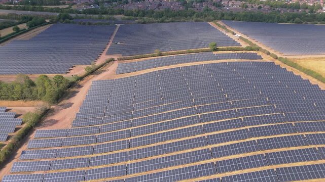 An aerial drone pull back move showing the scale of the site and the farmland that it takes up