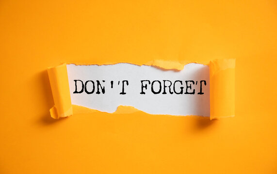 Don't Forget handwritten message on sticky note