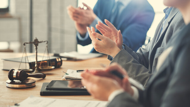 Business partners celebrating a successful legal agreement
