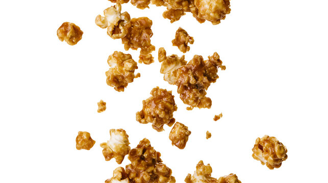 Caramel popcorn clusters falling and floating