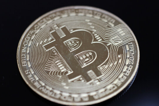 Close Up of Bitcoin Cryptocurrency Coin on Black Background