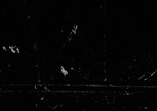 Vintage analog noise and grain overlay on black background.Distressed VHS static and scratch Texture.