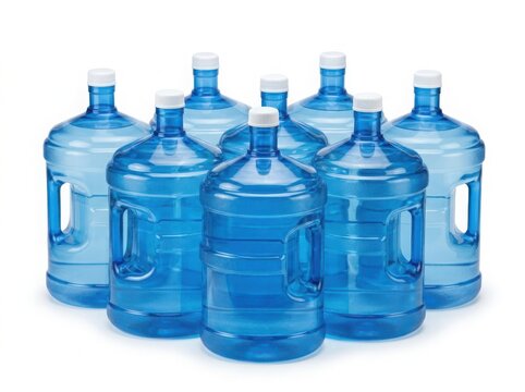 Stack of large blue water bottles with caps and handles isolated on white background