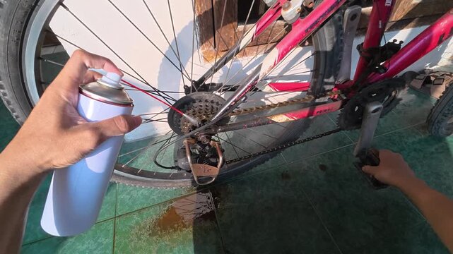Bicycle maintenance and lubrication in Gresik, Indonesia - August 10, 2026