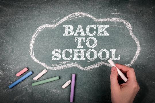 BACK TO SCHOOL Message Written in Chalk on Classroom Blackboard