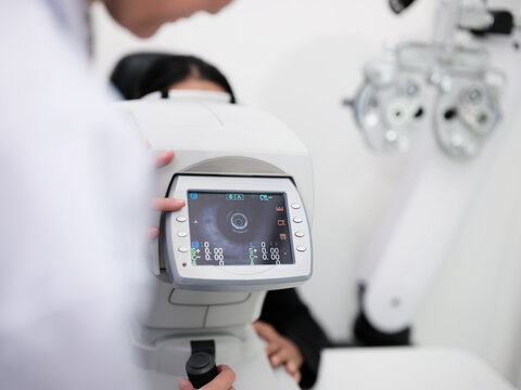 Close-up, refractometer device screen, patient eye exam, vision and eyesight improvement by expert optometrist, diagnostic for eyeglasses lens, professional technology services in optical clinic.