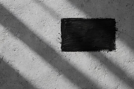 Black Rectangle Shadow on Textured Wall Background.