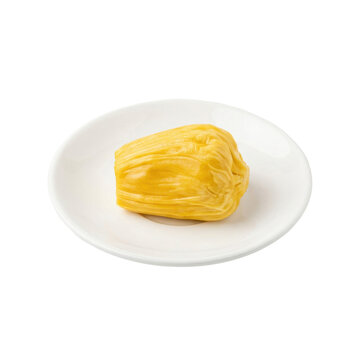 A fresh ripe yellow jackfruit bulb served on a small white plate, showcasing its juicy texture and exotic sweet flavor, ideal for food and tropical fruit concepts.