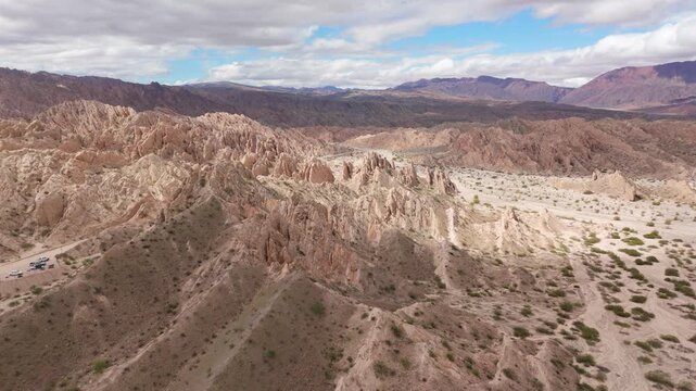 Wide aerial establishing dolly of Quebrada de las Flechas sandstone formations and desert basin, Salta Region Argentina