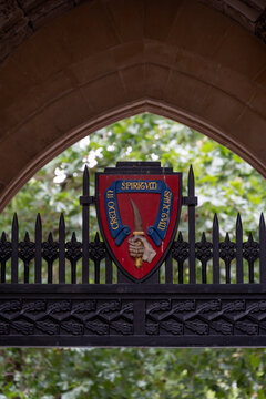 LONDON, UK - JULY 14, 20026:  shield and motto in the gatehouse entrance to St Bartholomew the Great church in Smithfield