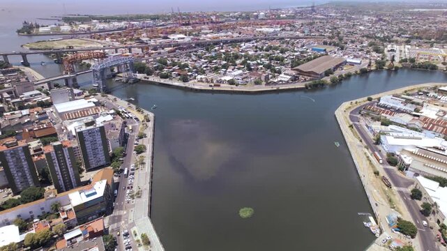 4K drone aerial view of La Boca waterfront in Buenos Aires, Argentina. Historic port area with colorful surroundings, docks and one of the city&rsquo;s most iconic neighborhoods.