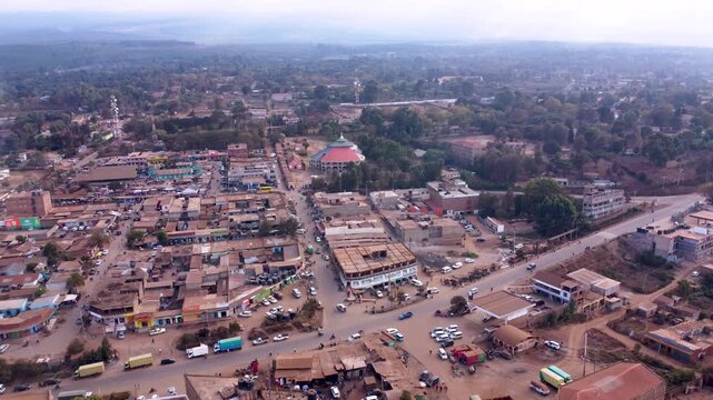 Aerial drone footage of the bustling Loitokitok town and open-air market in Kenya, showcasing traders, retail stalls, local commerce, and one of southern Kenya's busiest marketplace centers.