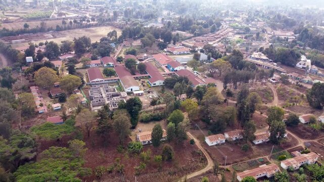 Drone footage of Loitokitok Level 5 Hospital in Kajiado County, Kenya, showcasing the medical campus, healthcare infrastructure and surrounding community near Mount Kilimanjaro.