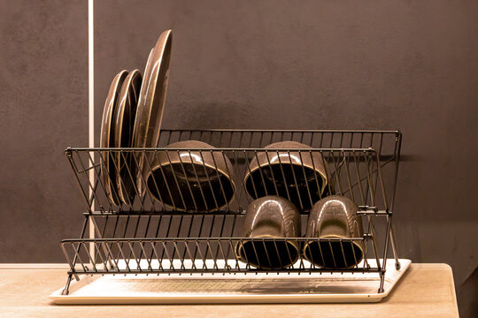 Metal dish drainer features a practical design for natural drying of washed dishes