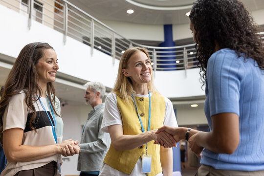 Happy Professionals Shaking Hands in Office