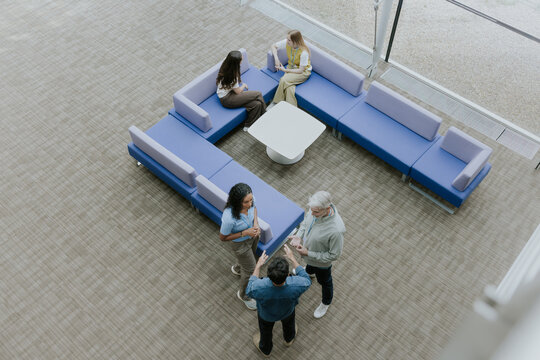 Aerial View of Colleagues Engaging in Conversation