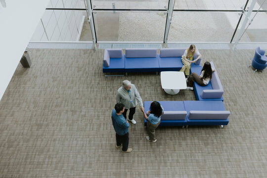 Overhead shot of Collaborative Meeting in Modern Office Space Design