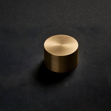 Minimalist Brass Weight on Charcoal Background