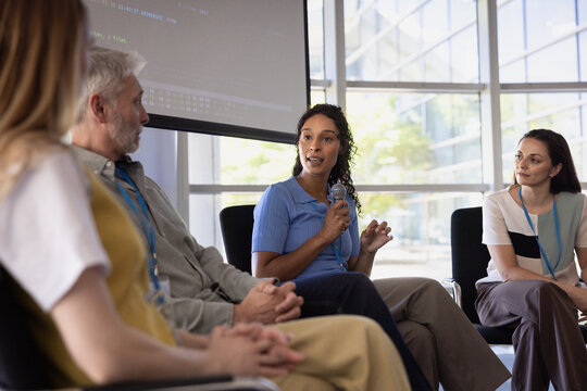 Businesswoman speaking on a panel at a conference