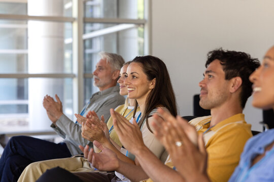 Engaged Audience Applauding A Speaker At Conference
