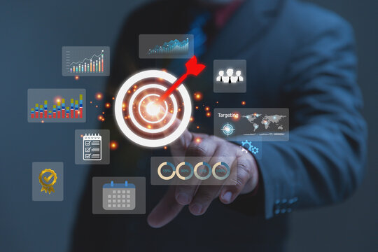 Businessman Reaching Out to Touch Futuristic Analytical Bullseye Interface Screen.