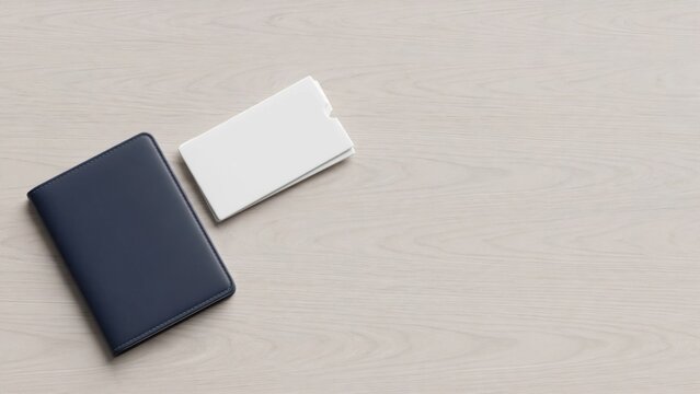 Minimalist Overhead View of a Dark Blue Notebook and White Business Card.