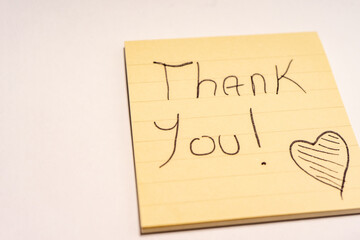 A handwritten note with the text Thank You  on it. © Sonny