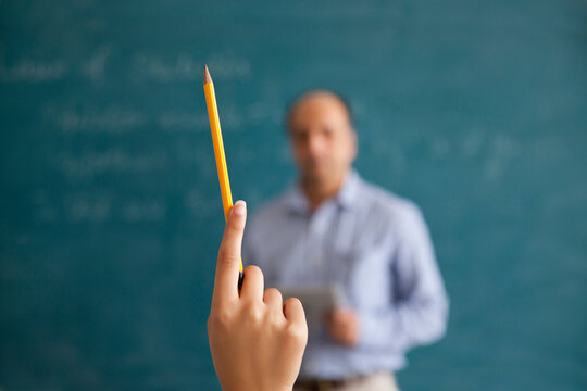 Close-up of hand holding a pencil