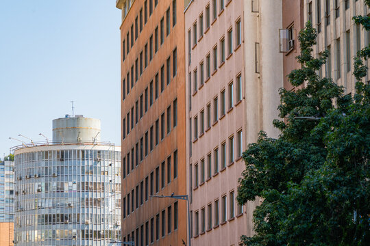 Perspective view of office building facades with geometric windows pattern