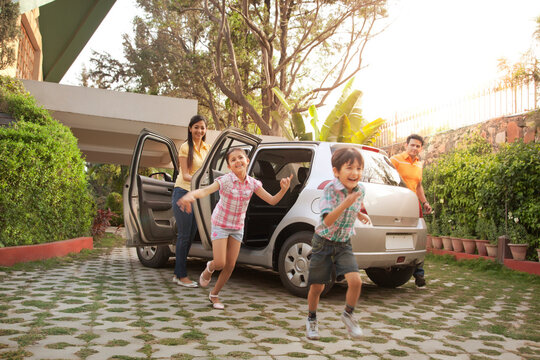 Family getting out of a car
