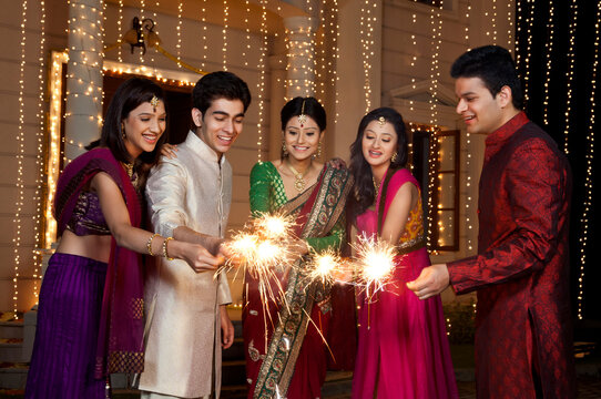 Friends playing with sparklers