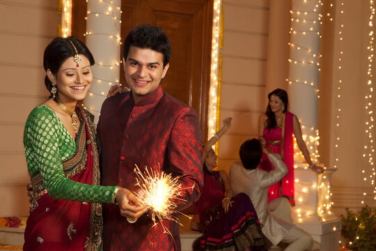 Couple playing with sparklers