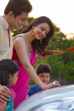 Woman putting tili on new car