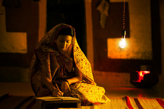 Rural woman studying at night