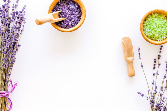 cosmetic set with lavender herbs and sea salt in bowl on white table background flat lay mockup