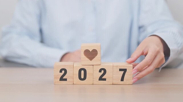Happy New Year 2027 with heart block for health care, love, organ donation, resolution, charity, happy family, wellbeing and insurance concepts