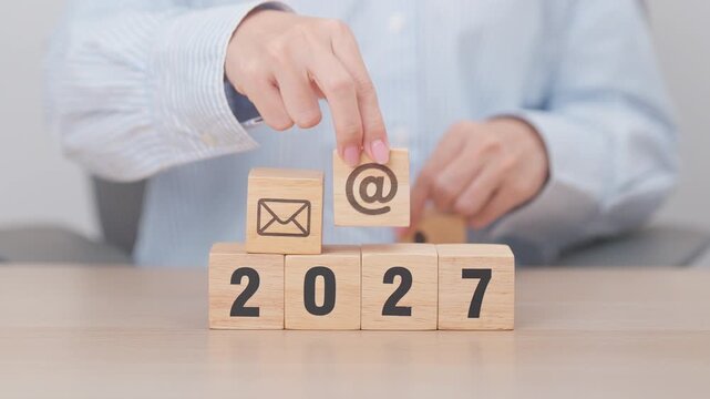Happy New Year 2027 block for Contact Us concepts. Wood block of Email, call Phone and Website Address sign. For Customer support hotline, business Marketing, Corporate, communication and Advertising
