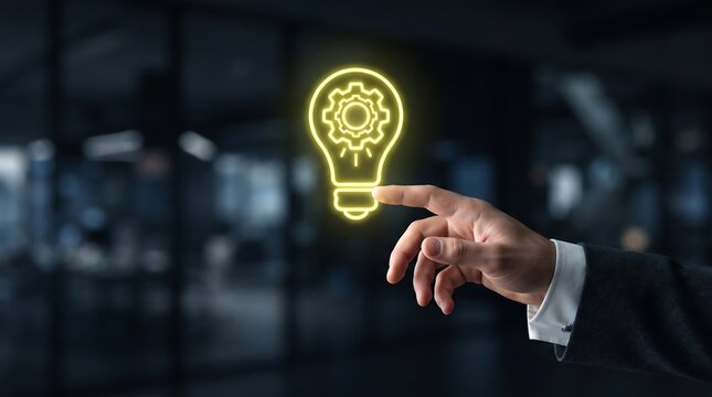 A person interacts with a glowing digital lightbulb representing innovation and technological advancement in a blurred office environment