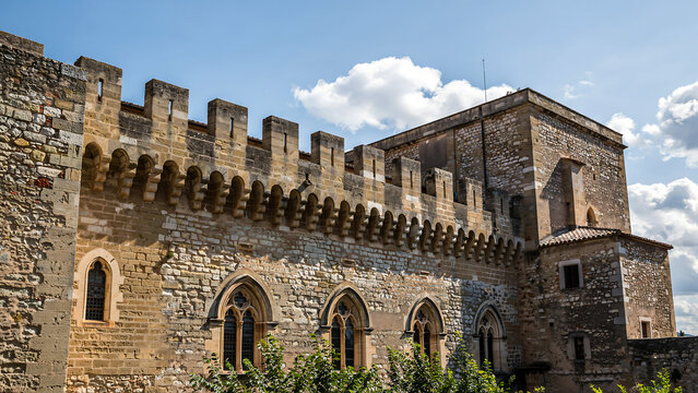 Ancient fortress wall with stone battlements and arched medieval fortress