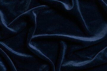 Obraz premium Luxury navy blue velvet fabric background texture with soft folds