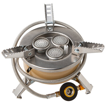 Portable triple burner camping gas stove with hose isolated on white background. High power outdoor burner stove with piezo ignition studio shot