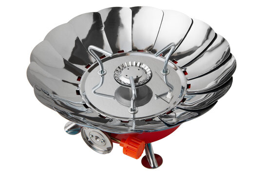 Portable camping gas stove with open lotus wind baffles isolated on white background. Compact outdoor burner stove studio shot