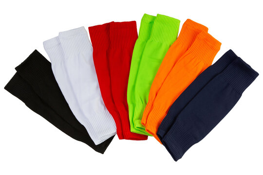 Multicolor collection of footless soccer socks isolated on white background. Fan layout of colorful football calf sleeves top view studio shot