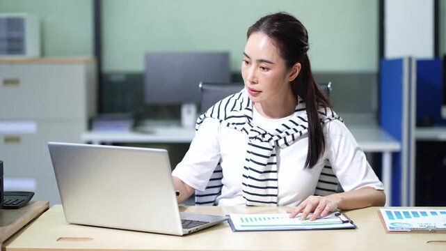 woman consultants discuss tax, merger strategy and restructuring in modern office.