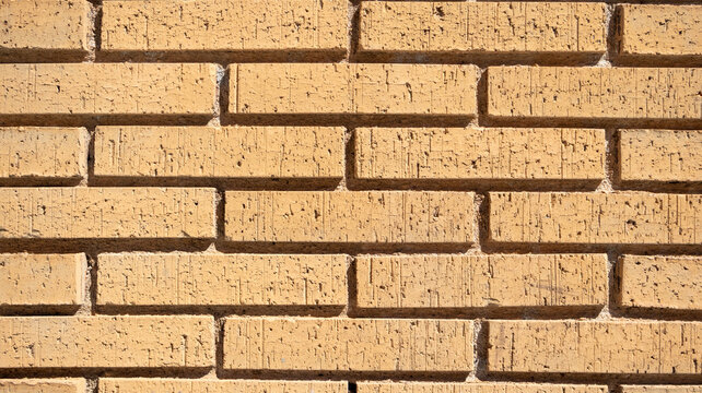 Textura de pared de ladrillo amarillo claro