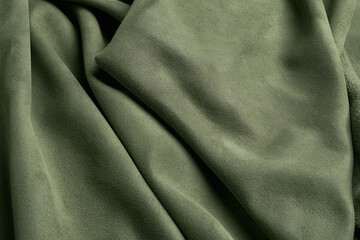 Obraz premium Sage olive green suede leather fabric macro background with smooth texture