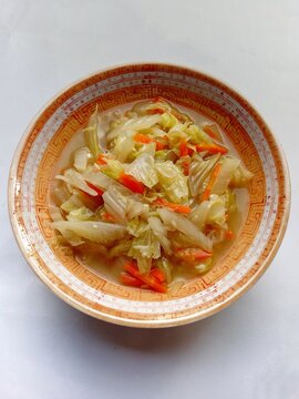 Stir-fried Napa Cabbage and Carrots in a Patterned Ceramic Bowl