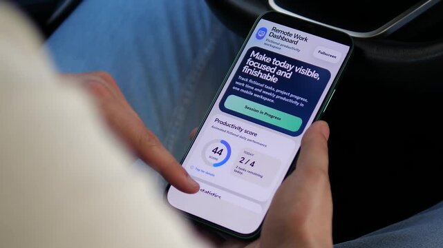 Person starts a remote work session on a smartphone as tasks are completed and the productivity score rises, highlighting measurable performance, focus and hybrid work.
