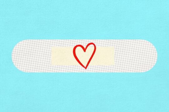 A white adhesive bandage with a red heart drawing on blue background