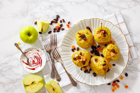 Freshly baked green apples with cinnamon, raisins